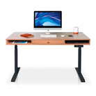 Bureau assis-debout KQUEO Space Dynamique en bois clair avec 1 tiroir et pieds noirs.